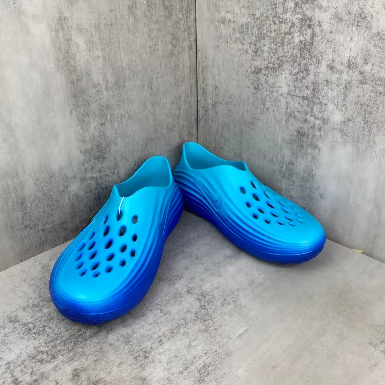 nike reactx rejuvenation slides in blue: aqua coded recovery nike reactx rejuvenation slides in blue: aqua coded recovery