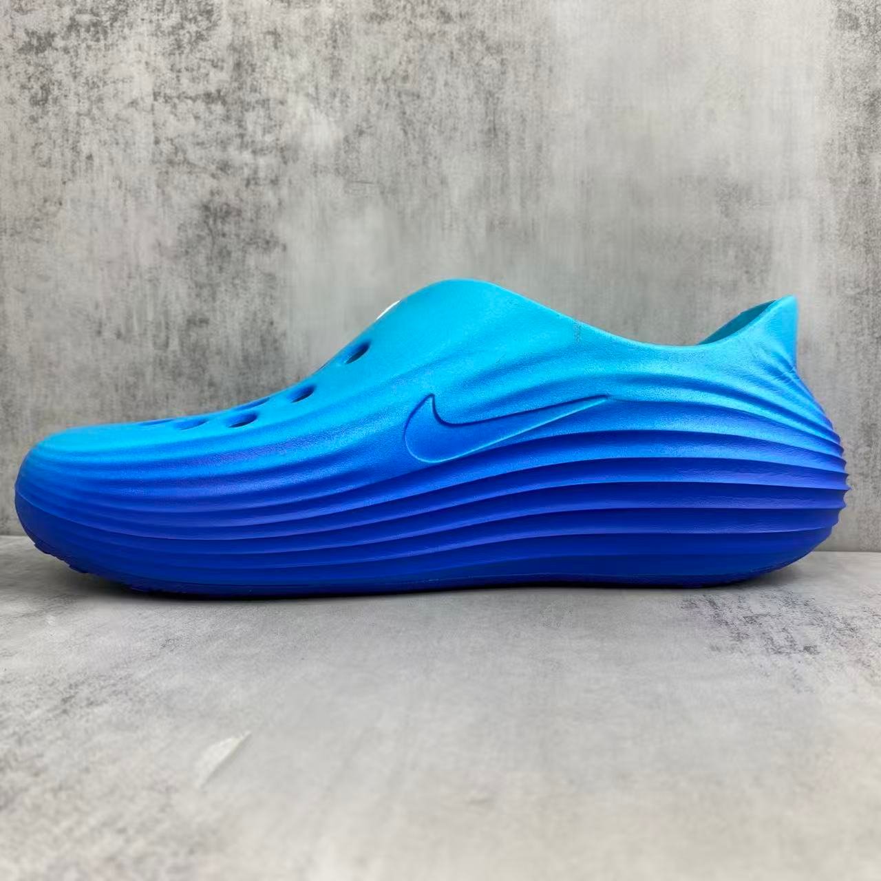 nike reactx rejuvenation slides in blue: aqua coded recovery nike reactx rejuvenation slides in blue: aqua coded recovery